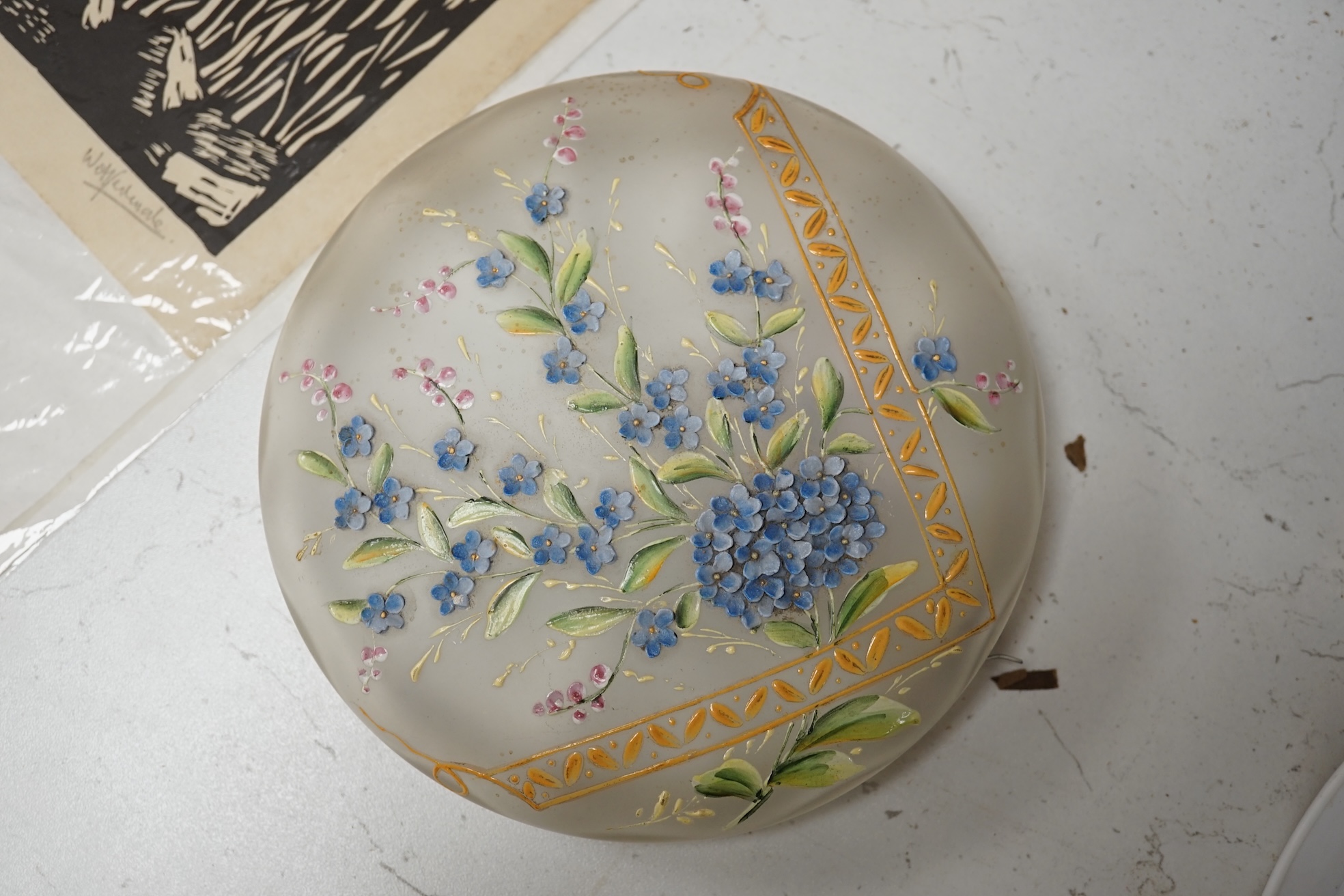 A Bohemian forget-me-not enamelled glass box and cover 18cm diameter. Condition - poor to fair, hinge broken.